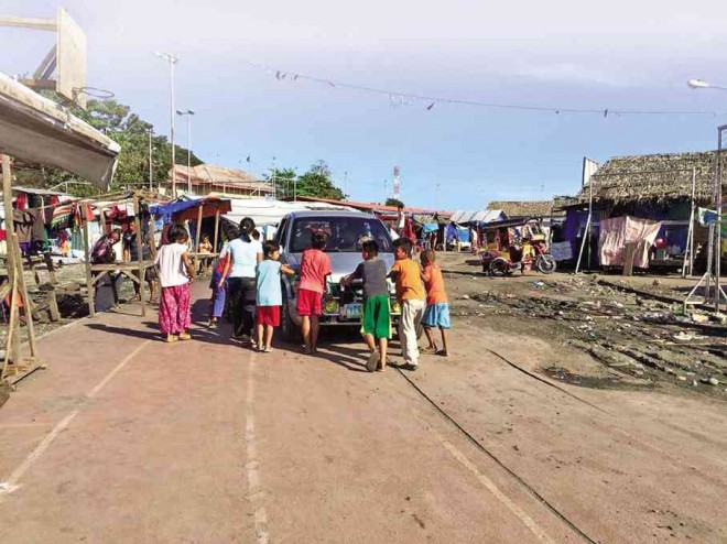 What used to be a track and field oval became a growing colony of shanties and villagers searching for answers to why the communities they used to live in before the MILF terror attack on Zamboanga City had been declared no build zones. JULIE S. ALIPALA/INQUIRER MINDANAO