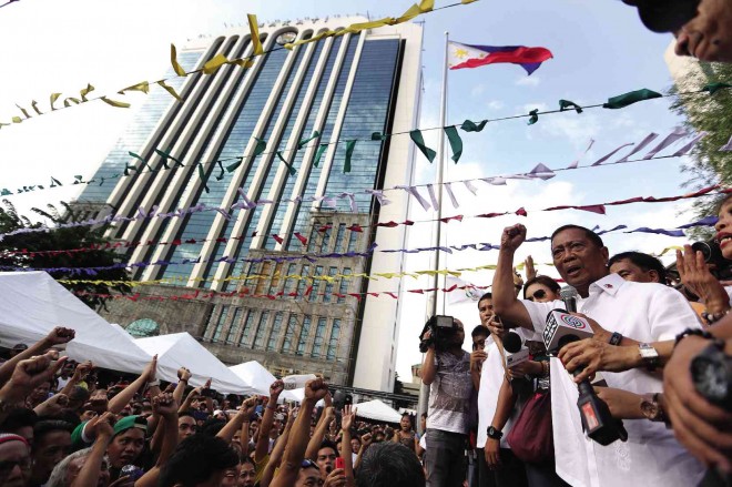 DEFYING OMBUDSMAN ORDER ANEW  Vice President Jejomar Binay addresses supporters gathered at Makati City Hall as his son, Makati Mayor Junjun Binay, defies a suspension order from the Office of the Ombudsman for his role in  the allegedly overpriced Makati Science High School building. The mayor also refused to heed the suspension order of the Ombudsman early this year for his role in the allegedly overpriced Makati City Hall Building II.  RAFFY LERMA