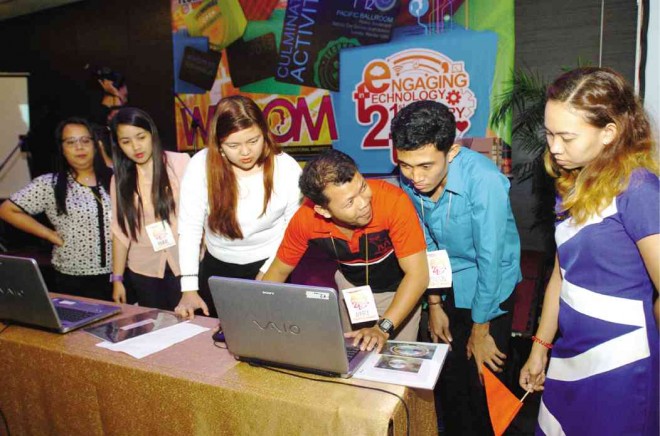 PARTICIPANTS of Wisdom 2015 hurdle the PhotoShop challenge, where they have to edit a photo to match a sample given to them. Photos by RODEL ROTONI