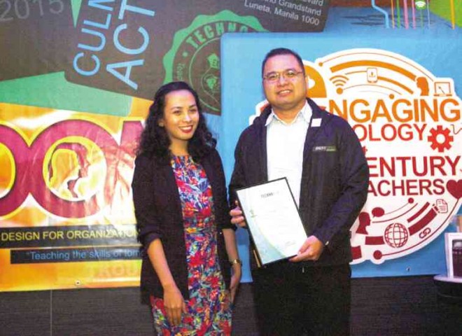 VIENNA Austria (above), assistant curriculum manager of TechnoKids Philippines, awards a plaque of recognition to John Gary Garcia of Poveda