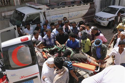 People carry the body of a man who was killed during clashes between tribal fighters loyal to the exiled President Abed Rabbo Mansour Hadi and Shiite rebels known as Houthis in the western city of Taiz, Yemen, Sunday,. AP