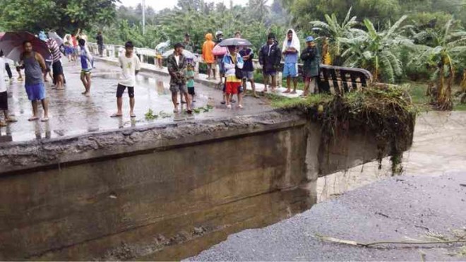 RESIDENTS of the village of Concepcion in Koronadal City find themselves cut off from the rest of the city after strong river currents swept away a portion of the village bridge. AL SALUDO/CONTRIBUTOR 