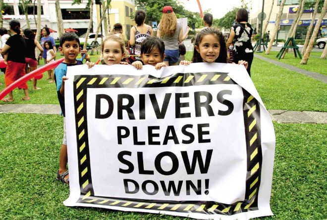 CHILDREN get involved in a march to demand that drivers learn the importance of road rules and pedestrian safety at the BGC in Taguig City. Richard Reyes
