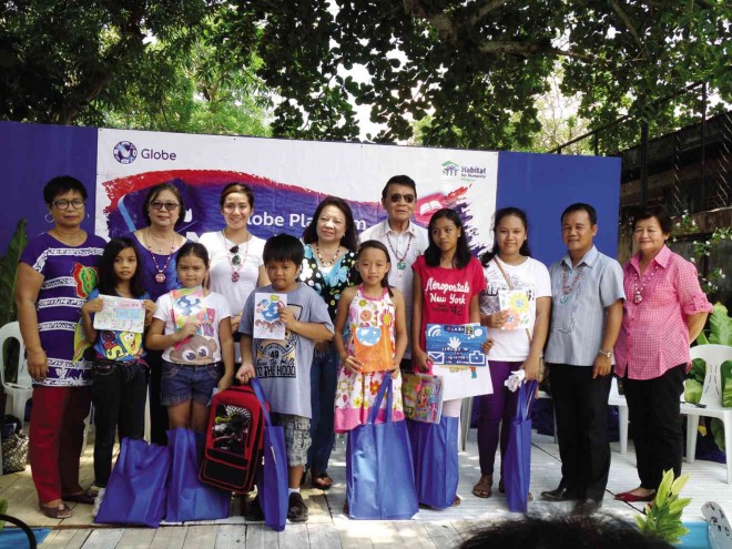 JONAR de la Cruz (front, third from left) topped the card design contest while Ariane Joy Francisco (fifth from left) received the most creative award.   Standing beside them are  Servillon and  Ma. Gemma M. Ledesma, officer in charge, DepEd regional office. Behind are Fuentes, Lih, Del Carmen, Quimo and Morana.