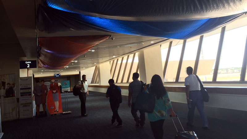 West concourse. Tarpaulin covering ceiling. PHOTO BY JEANETTE ANDRADE