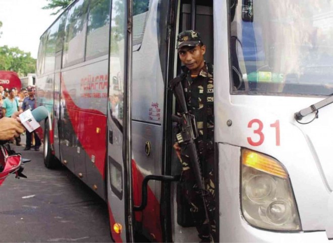 CPL. RENE PRAJELE stares out of the Peñafrancia Tours bus before surrendering to authorities at the end of a five-hour hostage drama in Del Gallego, Camarines Sur.  PHOTO COURTESY OF ARMY 9TH ID PUBLIC AFFAIRS OFFICE  