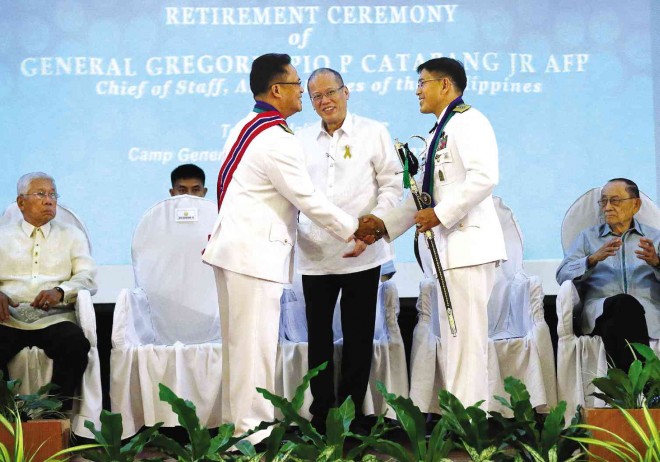 HAIL TO THE CHIEFS  Gen. Gregorio Pio Catapang Jr. (left) turns over command of the Armed Forces of the Philippines to the new military chief of staff, Lt. Gen. Hernando Iriberri (right) in the presence of their Commander in Chief, during ceremonies held at Camp Aguinaldo, Quezon City, on Friday. Behind are Defense Secretary Voltaire Gazmin and former President Fidel Ramos. RAFFY LERMA
