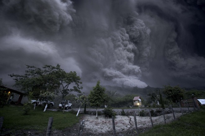 Clouds of ash fill the sky after an eruption by the Colima volcano, known as the Volcano of Fire, near the town of Comala, Mexico, Friday, July 10, 2015. The volcano spewed ash more than 4 miles (7 kilometers) into the air and released some quantity of lava. People were advised to recognize a 3-mile (5-kilometer) perimeter around the peak. (AP Photo/Sergio Tapiro Velasco)