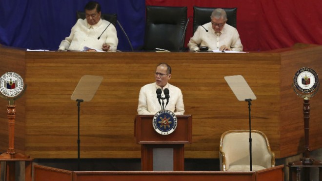 Philippine President Benigno Aquino III, center, delivers his last State of the Nation Address as Senate President Franklin Drilon, left, and House Speaker Feliciano Belmonte, right, looks on during the joint session of the 16th Congress at the House of Representatives in suburban Quezon city, north of Manila, Philippines on Monday, July 27, 2015. (AP Photo/Aaron Favila)