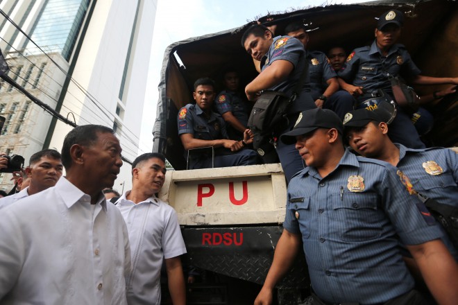 BINAY/JUNE 29,2015 Vice president Jejomar Binay inspects NCRPO police deployed ouside the Makati City Hall, this comes after the camp of Makati Mayor Jejomar Erwin "Junjun" Binay claimed city department heads received copy of the suspension oredr of the mayor and other city officials in relation to the investigation of the Makati Science High School. INQUIRER PHOTO/RAFFY LERMA