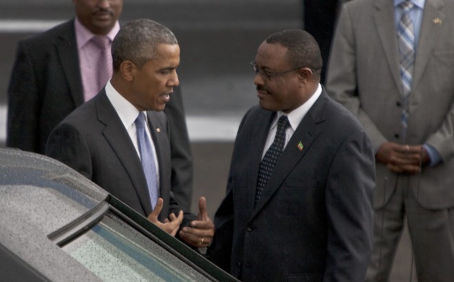President Barack Obama with   Ethiopian prime minister Hailemariam Desalegn, right,   at Bole International Airport  Addis Ababa , Ethiopia, Sunday July 26, 2015.  Obama is traveling on a two-nation African tour where he will become the the first sitting U.S. president to visit Kenya and Ethiopia.  (AP Photo / Sayyid Azim)