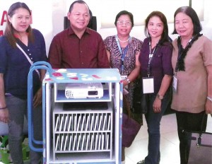 Officials of the beneficiary schools show off the contents of a technocart 