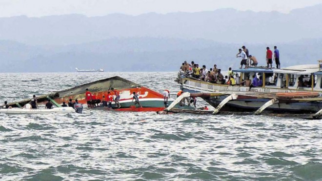 DISASTER AFTER MIDDAY  Rescuers search the hull of the  MB Nirvana for survivors after the wooden outrigger ferry capsized in rough seas off Ormoc City after midday on Thursday. At least 35 of the nearly 200 people on board the vessel died in the accident. CONTRIBUTED PHOTO FROM MIQUICAR PHOTO STUDIO