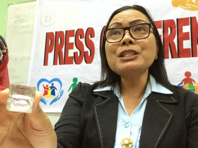 Ruby Constantino, assistant regional director of DOH9 shows the expired Benzol taken from a woman in Dipolog City. She said DOH is not issuing Benzol a branded medicine, but a generic, Albendazole.