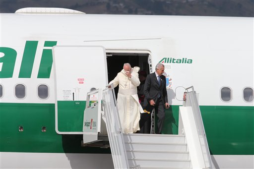 Pope Francis disembarks from his plane upon his arrival in the Mariscal Sucre International airport in Quito Sunday July 5, 2015. History's first Latin American pope returns to Spanish-speaking South America for the first time on Sunday to visit Ecuador, Bolivia and Paraguay. AP PHOTO/FERNANDO LLANO