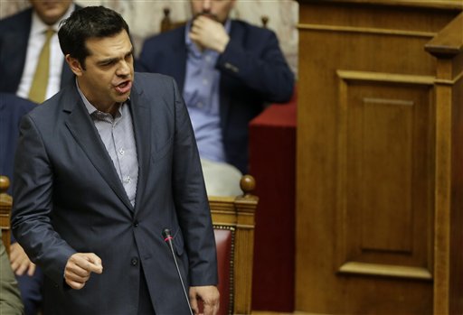 Greece's Prime Minister Alexis Tsipras reacts as he speaks during a parliament meeting in Athens, Saturday, July 11, 2015. Greek lawmakers have approved a government motion seeking authorization for reform proposals as a basis for negotiations for a third bailout in talks with international creditors this weekend. AP