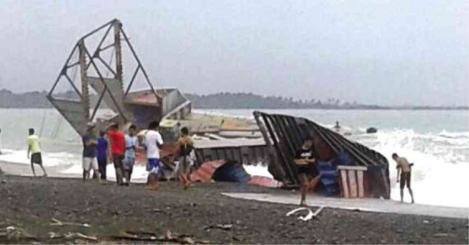 THE CONSUNJI-operated barge washed ashore in the town of Bugasong, Antique province. CONTRIBUTED PHOTO