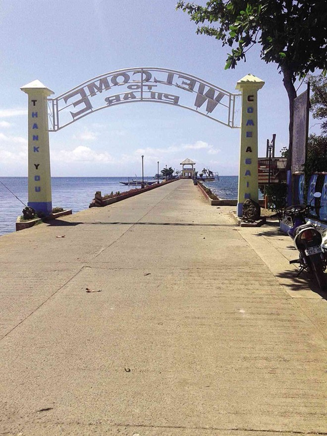WELCOME arch at the port leading to Pilar town   PHOTOS BY JHUNNEX NAPALLACAN/INQUIRER VISAYAS