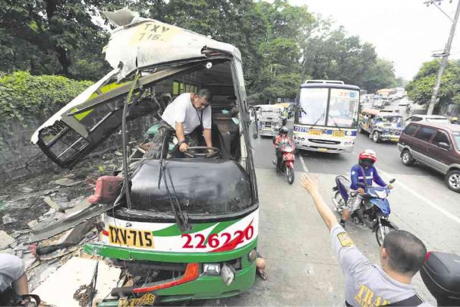 BORDER TRAGEDY  The wayward Valisno bus ends up a wreck on  Wednesday morning on Quirino Highway, after crashing into the boundary marker between Quezon City and Caloocan City, leaving four passengers dead and at least 18 others injured. EDWIN BACASMAS