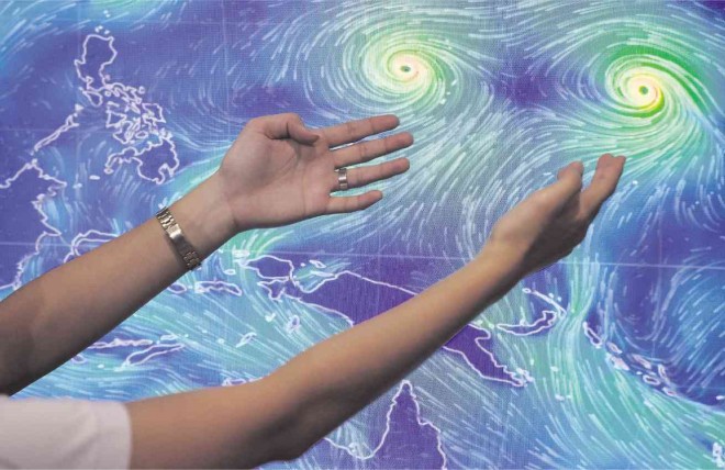 STORMS LIKE VAN GOGH’S STROKES  The eyes of Typhoon “Ineng” and Typhoon “Atsani” are captured in a satellite image of the storms over the Pacific. Ineng is expected to enter the Philippine area of responsibility Tuesday afternoon and may hit the northern tip of Luzon by the weekend. The image of the typhoons is eerily similar to the stars painted by the Dutch artist Van Gogh in “The Starry Night.”  GRIG C. MONTEGRANDE