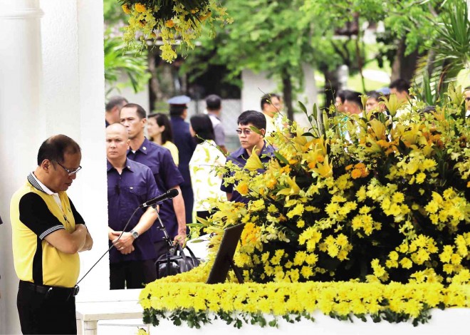 SOLEMN, SOLITARY, SOULFUL  A pensive President Aquino spends a few moments alone—apart from the crowd—by the grave of his father, martyred Sen. Benigno “Ninoy” Aquino Jr.,  at his 32nd death anniversary on Friday. Three of Mr. Aquino’s sisters—Ballsy Aquino-Cruz, Viel Aquino-Dee and Pinky Aquino-Abellada—joined him in visiting the flower-bedecked tomb of their father at Manila Memorial Park in Parañaque City. RAFFY LERMA 
