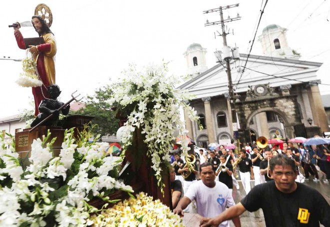 SAINT WITH A BLADE  The procession bearing the image of San Bartolome de Malabon leaves its historic, four-century-old church on his feast day, Aug. 24.        NIÑO JESUS ORBETA