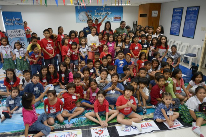 20150829 INQUIRER READ-ALONG / Police Senior Supt Camilo "Tito Picoy" Cascolan, Air Force Col Maxima Ignacio, Ms Milagros Banan of E Rondon HS, and Dyali Justo poses with the kids after the Inquirer Read-Along session held at the Multipurpose Room of Philippine Daily Inquirer Office, Chino Roces, Makati City. INQUIRER PHOTO / ELOISA LOPEZ