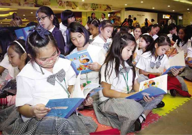 HUNDREDS of elementary students from public and private schools participate in the annual book reading day at SM Megamall.