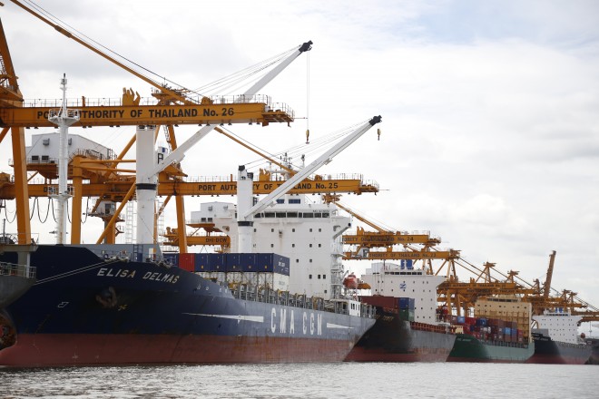 In this Thursday, Aug. 6, 2015, photo, cargo ships are parked near Klong Toey Port in Bangkok, Thailand.  The Association of Southeast Asian Nations, which on Saturday marks 48 years since its establishment, aims to establish an economic community known as the AEC by the end of this year. Proponents say the ultimate goal is to allow free trade, investment and movement of workers between the 10 nations that make up the grouping. But progress toward a borderless economy in a region that brings together democracies and dictatorships along with rich and poor nations is likely to be slow. (AP Photo/Penny Yi Wang)