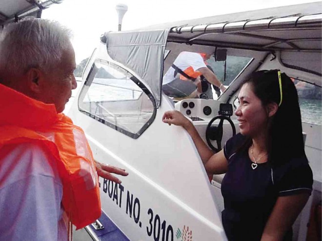 NATIONAL Scientist Dr. Angel C. Alcala (left) discusses with Vivien Facunla of Ecofish Project for fish monitoring at the marine protected area of Coron, Palawan province, during a site visit. The project in Coron seeks to rehabilitate the area. It is implemented by Ecofish and the Bureau of Fisheries and Aquatic Resources with help from the US Agency for International Development. CONTRIBUTED PHOTO