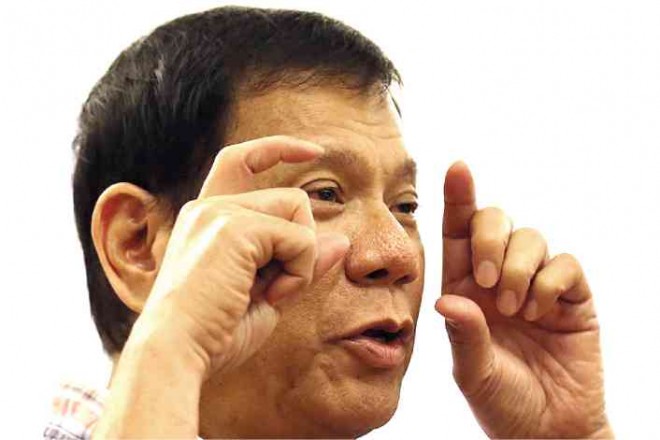 Rodrigo Duterte gestures during a speech at the founding anniversary of the Volunteers Against Crime and Corruption in July held in Camp Aguinaldo in Quezon City. RAFFY LERMA