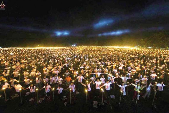 PARTICIPANTS in this year’s Light of Peace event light candles forming a giant image in San Enrique town in Iloilo province on Saturday. PHOTO COURTESY OF SAN ENRIQUE LGU/DMC PHOTOGRAPHERS