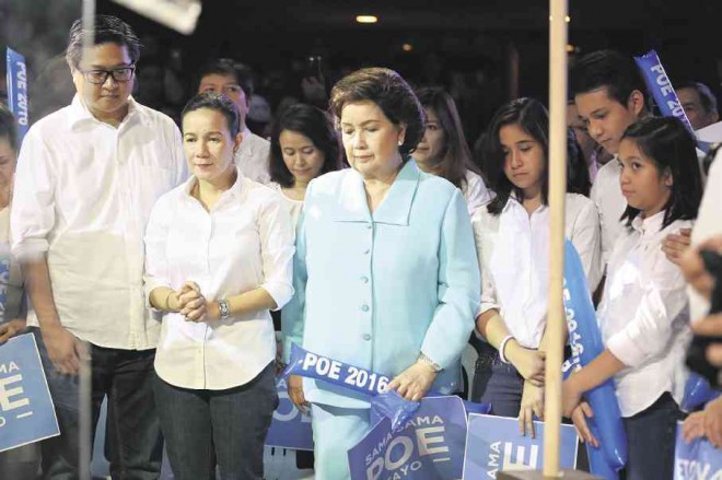 PRAYING FOR GRACE  Shortly before making her momentous announcement about seeking the presidency in 2016, Sen. Grace Poe (second from left) shares a prayer with her family: (front row, from left) husband Neil Llamanzares, mother Susan Roces, daughter Hanna, son Brian and daughter Nikka.  LYN RILLON