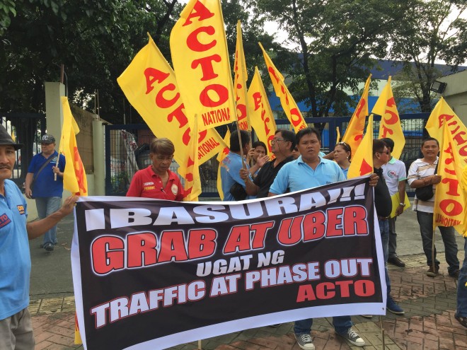 Members of Alliance of Concerned Transport Organizations (ACTO) staged a rally to call for the suspension of the accreditation of Uber and GrabCar as it threatens their livelihood and contributes to the worsening traffic situation in Metro Manila. ARIES JOSEPH HEGINA/Inquirer.net