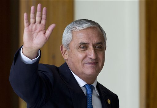 In this Monday, Aug. 31, 2015 photo, Guatemala's President Otto Perez Molina waves at the end of a press conference in Guatemala City. The president's spokesman Jorge Ortega says Molina has resigned in the face of a fraud scandal. Ortega says Perez Molina submitted his resignation at midnight local time late Wednesday, Sept. 2, 2015, after a judge issued an order to detain him in a corruption scandal that has brought his government to the brink. AP