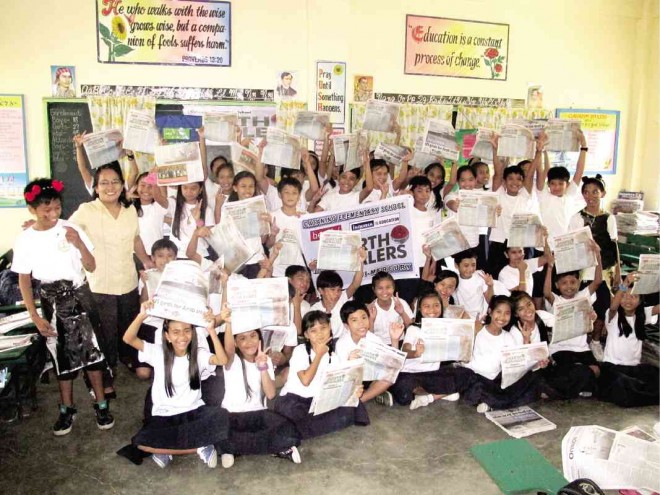 THE WRITER with her students at Cataning Elementary School in Balanga City back in 2012 when she was teaching fifth-grade English INQUIRER PHOTO