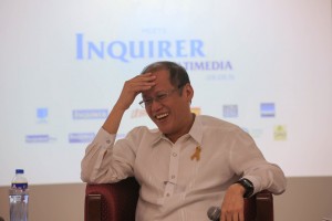 Philippine President Benigno Aquino III laughs during the Meet the Inquirer Multmedia forum