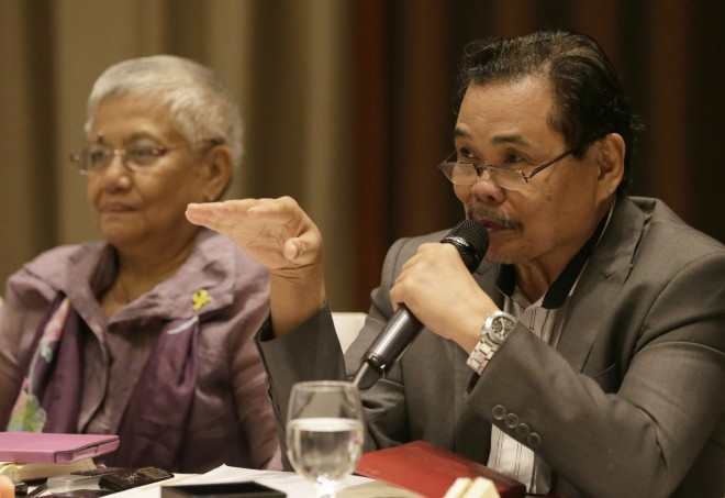 Moro Islamic Liberation Front (MILF) peace negotiator Mohagher Iqbal gestures during a forum with foreign correspondents based in the Philippines, on the passage of the Bangsamoro Basic Law (BBL) which would pave the way for the creation of a new autonomous political entity that would replace the Autonomous Region in Muslim Mindanao (ARMM) in southern Philippines, Friday, Sept. 18, 2015 at suburban Mandaluyong city, east of Manila. The rebel leader said changes being introduced in the proposed Muslim autonomy law under a peace deal are unacceptable but adds that the insurgents would continue to appeal to lawmakers to pass a legislation that can help end a decades-old rebellion in the country's south. The passage of the BBL was marred by a Jan. 25 incident that saw the killings of 44 elite police commandos by Muslim rebels in an operation to capture terrorist Zulkipli bin Hir, also known as "Marwan" inside an MILF territory. At left is Teresita Deles, presidential adviser on the peace process. (AP Photo/Bullit Marquez)