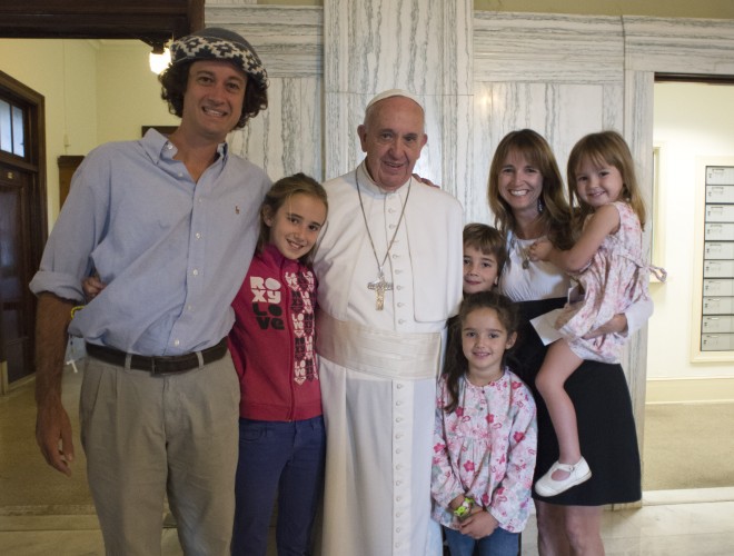 Pope Francis poses for a family photo with Catire Walker, left, Noel Zemboiran, second from right, and their children, from left, Cala, Dimas, Mia and Carmin during a meeting at the Saint Charles Borromeo Seminary in Philadelphia on Sunday, Sept. 27, 2015,. The Walker family made a 13,000-mile trip over 194 days from Argentina to Philadelphia in an old Volkswagen van to attend the World Meeting of Families.  L'OSSERVATORE ROMANO/POOL PHOTO VIA AP 