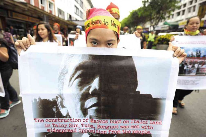 MARTIAL LAW REVISITED Around 50 activists marched in downtown Baguio on Monday to revisit the atrocities committed during martial law. Since the ouster of the late strongman Ferdinand Marcos, the monuments to his rule, including a giant bust along Marcos Highway, have been destroyed.    EV ESPIRITU/INQUIRER NORTHERN LUZON