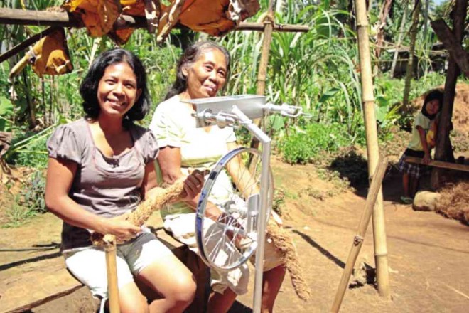 WOMEN in Barangay Malingao busy themselves with producing coco twine as an additional source of income for their families. JAY ROSAS/CONTRIBUTOR
