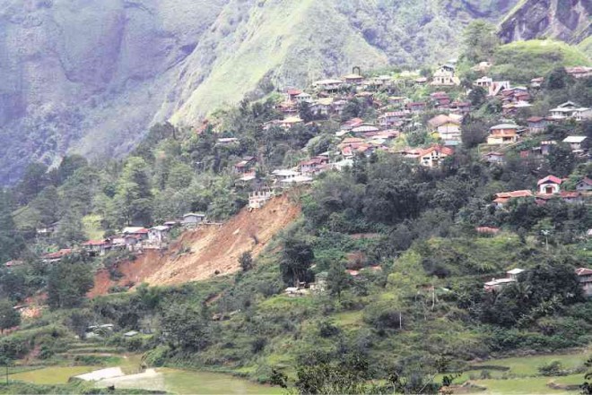DANGER ZONE  Typhoon “Ineng” revealed the limestone and mud-stone foundations of this section of Poblacion village in Bakun, Benguet province, which imperil some 20 households. PHOTO CONTRIBUTED BY MINES AND GEOSCIENCES BUREAU