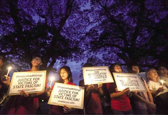 Students of the University Philippines Diliman call for an end to killings of indigenous peoples days after the execution by militiamen of Alcadev executive director and ‘lumad’ educator Emerito Samarca and two lumad in Lianga, Surigao del Sur province  on Sept. 1.     LYN RILLON