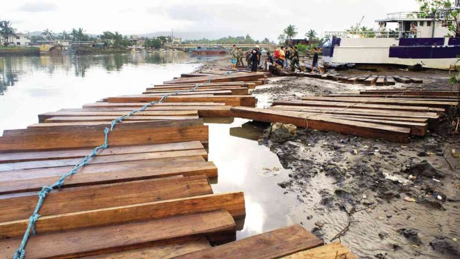 A FILE photo of illegally cut logs from Sierra Madre found abandoned in Mauban, Quezon province.     CONTRIBUTED PHOTO