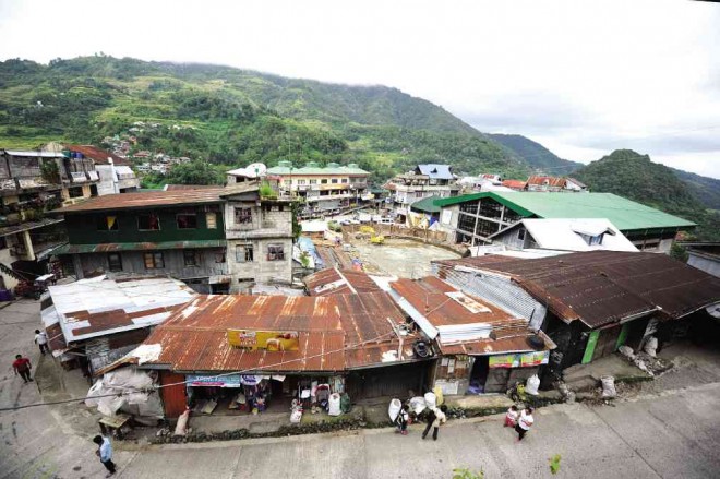 THIS is the town center of Banaue, Ifugao’s capital and home to the most frequented rice terraces. The narrow roads lead to a proposed car park building to house the vehicles of tourists. Over 80,000 visitors traveled to Banaue last year to see the terraces. But some residents oppose the parking building, arguing last week that it is being built on their communal assembly area. EV ESPIRITU/INQUIRER NORTHERN LUZON 