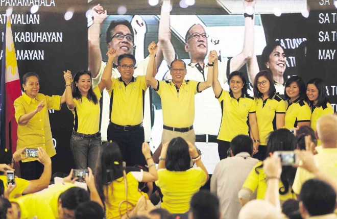LENI’S VP RUN OFFICIAL     Camarines Sur Rep. Leni Robredo (fourth from right) formally accepts the offer of Liberal Party (LP) standard-bearer Mar Roxas to be his running mate in the 2016 presidential election. President Aquino (center) raises the hands of the LP standard-bearer Mar Roxas (third from left) and Robredo at the event held on Monday at Club Filipino in San Juan City. On the left are Roxas’ mother Judy Araneta-Roxas and wife Korina Sanchez.  Robredo’s daughters Tricia, Jillian and Aika are shown on the right. NIÑO JESUS ORBETA