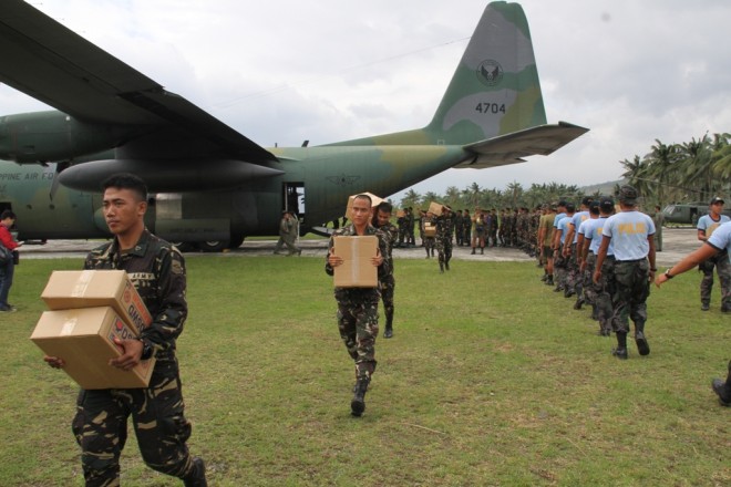 One of the two Philippine C-130 cargo planes carrying relief goods and disaster officials flew to typhoon-stricken towns in Aurora on Wednesday. FRANCES MANGOSING
