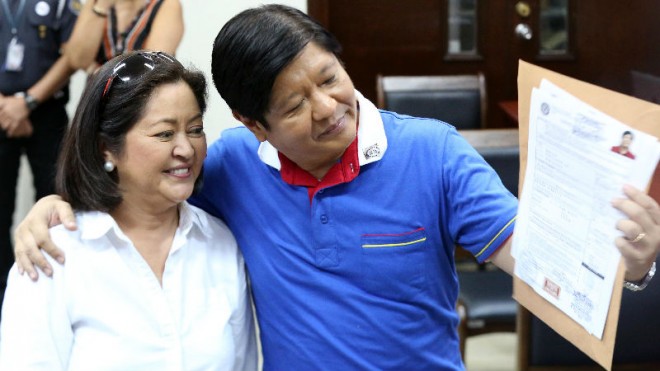 Senator Bongbong Marcos with his wife Iza Araneta files COC for Vice President at the Comelec, Tuesday. INQUIRER/ MARIANNE BERMUDEZ