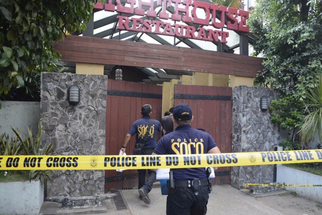 SHOOTING IN LIGHTHOUSE Police scene of crime investigators enter Lighthouse Restaurant on Gen. Maxilom Avenue in Cebu City following the shooting of two Chinese diplomats allegedly by a fellow Chinese consular officer over lunch Wednesday. CHRISTIAN MANINGO / CEBU DAILY NEWS 