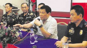 DAVAO City Mayor Rodrigo Duterte, with police and military officials, issued a 48-hour ultimatum to drug pushers to leave or be killed. PHOTO COURTESY OF THE City Information Office